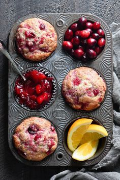 muffins with cherries and lemon on a tray