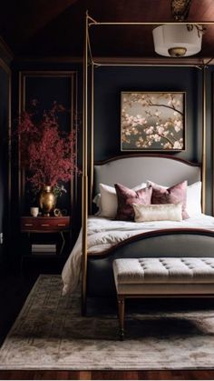 a bedroom with a canopy bed, rug and paintings on the wall above it's headboard