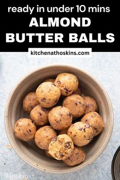 a bowl filled with almond butter balls on top of a table