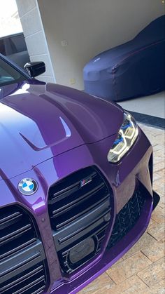 the front end of a purple sports car