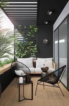 an outdoor living area with black walls and white furniture, potted plants on the balcony