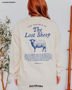 This Unisex garment-dyed long sleeve t-shirt features "The Parable of the Lost Sheep | Matthew 18:11-13" with a vintage sheep illustration on the back and "He left the ninety-nine to rescue me" on the front. Spread God's love and the gospel with this Christian tee <3 Make sure to check out the other garment options below :) » O P T I O N S « ‣ Tshirt: https://www.etsy.com/listing/1678902467 ‣ Crewneck: https://www.etsy.com/listing/1585469082 ‣ Hoodie: https://www.etsy.com/listing/1649314138 ‣ To T Shirt Design Christian, Minimalist Tshirt Design Graphic Tees, Christian T Shirts Designs, Gospel Clothing, Bible Verse Long, Jesus Parables, Minimalist Tshirt Design, Jesus T Shirts, Church Tshirt