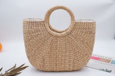 The handicraft this high quality and beautiful bag Perfect to be used for: Beach Shopping Normal daily use Shop the latest styles of popular handbags & best handbags for women Straw Weave Handbag with Detachable Strap bag is 100% handcrafted by local Thailand artists, from a waterhyacinth. The work is exquisite and of a very high quality. the bags is created with love and hand worked, that makes it unique and one of a kind also a perfect bag or gift for a girl Material: water hyacinth Lining : c Casual Bags For Beach Season With Round Handle, Casual Beach Season Bag With Round Handle, Casual Round Handle Bag For Beach Season, Straw Bag With Round Handle For Vacation, Straw Bags With Round Handle For Vacation, Beach Bag With Large Capacity And Round Handle, Vacation Straw Bags With Round Handle, Summer Vacation Bag With Round Handle, Beach Season Bag With Braided Round Handles