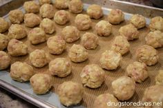 there are many balls of food on the baking sheet