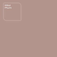 an image of a white square with the words mild plum on it in front of a brown background