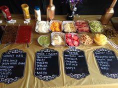 the table is covered with many different types of food and drinks, as well as menus