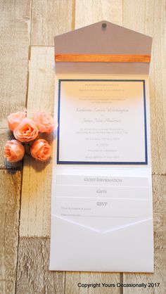 the wedding stationery is laid out with flowers