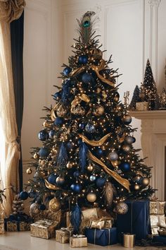 a decorated christmas tree with blue and gold ornaments