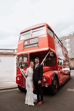 Bride in long sleeve lace wedding dress stands with her groom in front of London red bus with white ribbon to the front London Bus Wedding, Bus Photoshoot, Calla Blanche Wedding Dress, Blanche Wedding Dress, Diy Wedding Favours, Hackney Town Hall, London Red Bus, Burnt Orange Bridesmaid Dresses