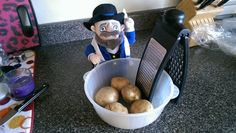 a pot full of potatoes sitting on top of a counter