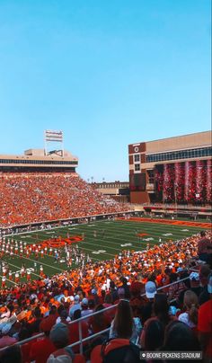 an orange and white football stadium filled with people