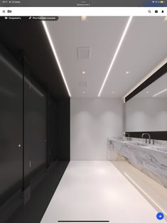 an image of a large bathroom with marble counter tops and white walls, along with black cabinets