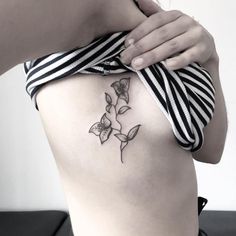 a woman with a tattoo on her stomach