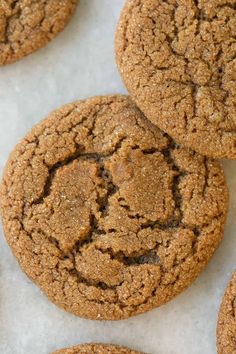 several cookies are arranged on a white surface