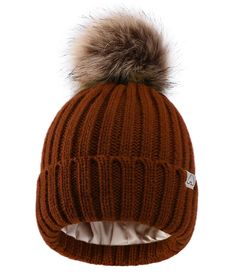 a brown hat with a fur pom