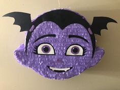 a paper bat hanging on the wall