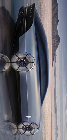 the futuristic car is parked on the beach