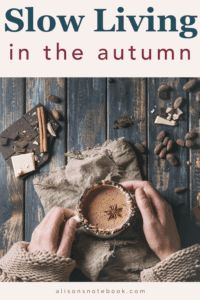 the cover of slow living in the autumn, with hands holding a small bowl filled with nuts