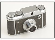 an old fashioned camera is shown on a white background