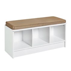 a white bench with a brown cushion on the top and two shelves below it for storage