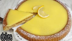 a lemon tart with a slice cut out