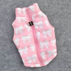 a pink dog jacket with white hearts on it