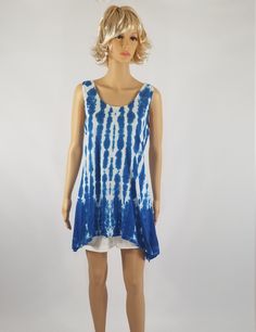 NEW size 3XL now available! Ladies Tie Dyed blue and white striped Shibori dyed tunic top. Remember that all computer monitors vary and the colors of this top have not been edited for color. I hand dye all of my items myself and as such slight variances may occur in the dyeing process, as such please remember to enjoy an artists hand. I will try to get this as close to the photograph as possible. Made of 100% Cotton. The tank tunic has a turned and & stitched down V-neckline, armholes & Indigo Sleeveless Top For Spring, Sleeveless Indigo Tops For Spring, Hand Dyed Sleeveless Top For Spring, Blue Relaxed Fit Summer Tunic, Tie Dye Sleeveless Top For Summer, Casual Hand Dyed Tank Top For Summer, Casual Hand-dyed Tank Top For Summer, Sleeveless Tie Dye Tops For Summer, Sleeveless Tie-dye Tops For Summer