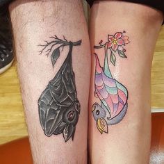 two people with tattoos on their legs, one has a bat and the other has a fish