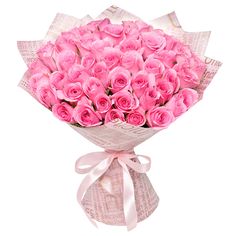 a bouquet of pink roses wrapped in paper