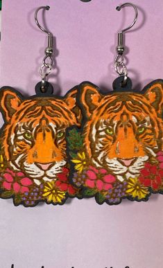 Description Roar with style and personality with our Bengal Tiger Hand Painted Wooden Wire Earrings. Made with high-quality wood, these lightweight earrings are durable and hypoallergenic for all-day comfort. Hand painted and laser cut, each pair is unique and crafted with love. Be wild and stand out from the crowd! Details Bengal Tiger wooden, hand painted From Moon Child Trinkets hooks: Hypoallergenic stainless steel; nickel and lead free Lightweight handmade with love Features One of a kind, Creative Memories Scrapbooking, Bengal Tiger, Creative Memories, Lightweight Earrings, Wooden Hand, Wire Earrings, Moon Child, Light Weight Earrings, Laser Cut