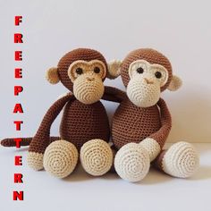 two crocheted monkeys sitting next to each other