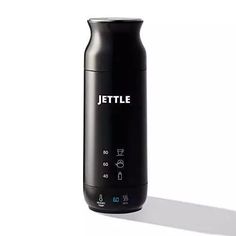 a black bottle with the word jettle on it sitting in front of a white background