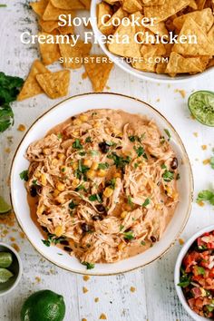 slow cooker creamy fiesta chicken in a bowl with tortilla chips on the side