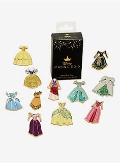 an assortment of princess pins in a box