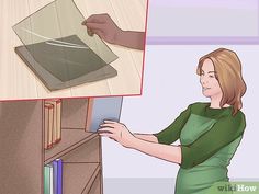 a woman is opening up a book shelf