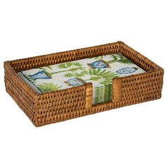 a brown wicker tray with blue and white designs