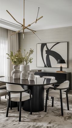 an elegant dining room with black and white decor