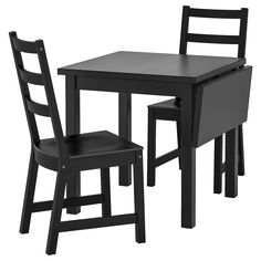 a black table and two chairs are shown