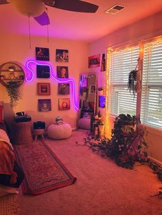 a living room filled with furniture and pictures on the wall