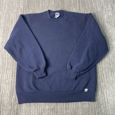 Vintage 90s Russell Athletic Basic Blank Sportswear Made in USA Streetwear Navy Pullover Crewneck Large Mens Condition:  Excellent Used Condition  = No Flaws Measurements: Please see photos above for all measurements IF YOU BUY TWO OR MORE ITEMS USE THE CODE BUNDLE @ CHECK TO SAVE 20% WE SHIP WITHIN 24 HOURS AFTER PURCHASE! Please be aware that we do not offer free returns!! The Buyer is responsible for the cost of the return label. Follow us on TikTok & Instagram @findsnostalgic and tag us in your finds 90s Sportswear, Vintage Crewneck, Russell Athletic, Saint Paul, Mens Sweatshirts, Vintage 90s, Favorite Outfit, Made In Usa, Adult Outfits