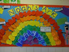 a bulletin board with handprints on it and words written in different colors that spell out noah's ark