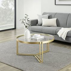 a living room with a couch, coffee table and rug