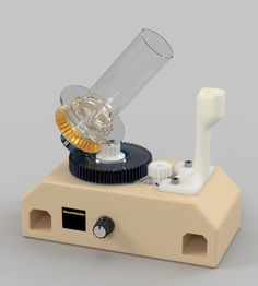 an electronic device with a glass tube on it's top and some metal parts in the middle