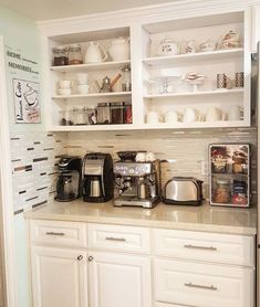 the kitchen is clean and ready to be used as a coffee bar or breakfast bar