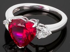 Love your heart Bella Luce ® ruby simulant and white diamond simulants 4.99ctw heart shape and round, rhodium plated sterling silver ring. Measures approximately 3/8"L x 1/16"W and is not sizeable. Red Heart Cut Jewelry With Accent Stones, Fine Jewelry Heart Cut Lab-created Ruby Ring, Red Heart Shaped Brilliant Cut Jewelry, Red Heart-shaped Brilliant Cut Jewelry, Heart Cut Lab-created Ruby Ring Fine Jewelry, Red Heart Cut Diamond Accented Jewelry, Red Heart Cut Diamond Accent Jewelry, Red Heart Cut Jewelry With Diamond Accents, Valentine's Day Ruby Jewelry With Center Stone