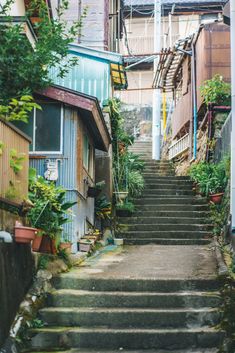 an alleyway with steps leading up to buildings