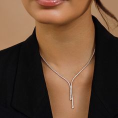 The Lily Necklace is all about effortless elegance. Encircling the neck in 3.38 carats of glittering diamonds, this style doubles up on sparkle with two asymmetrical drops featuring bezel-set pear diamonds resting on each end. Y Necklace Diamond, Timeless Diamond Jewelry, Modern Diamond Necklace, Modern Necklace Design, Lily Necklace, Diamond Drop Necklace, Double Necklace, Modern Necklace, Diamond Necklace Designs