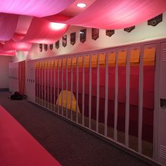 an empty hallway with red and yellow walls