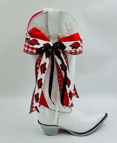 Arkansas-themed Bow Set for your cowgirl boots.  Proudly display your team spirit on your game day fit by adorning your boots with this festive set of bows! Five layers of trendy ribbon add an extra special flair to your day! Quickly clip them to your bootstraps with a gold 'o' ring... or use the rear set of ribbons to tie them on. Spoil yourself with this sassy set of boot bows that capture the essence of Game Day!   *Colors may vary slightly in person due to monitor settings. *Some ribbons may Boots With Ribbon, Ring Der O, Spoil Yourself, Cow Girl, Bow Set, Shoe Clips, School Colors, Cowgirl Boots, Team Spirit