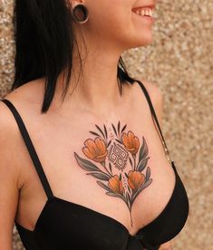 a woman with a tattoo on her chest